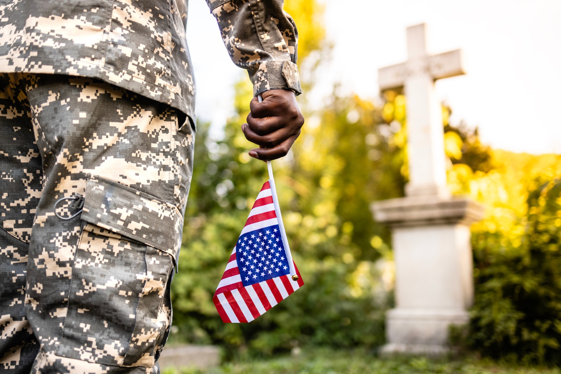 Soldier with American flag on Memorial Day.